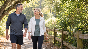 Active adults over 40 walking together on a neighborhood trail
