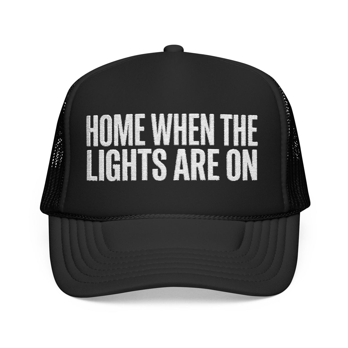 Black Home When The Lights Are On trucker hat, front view, white block lettering on the foam front panel.