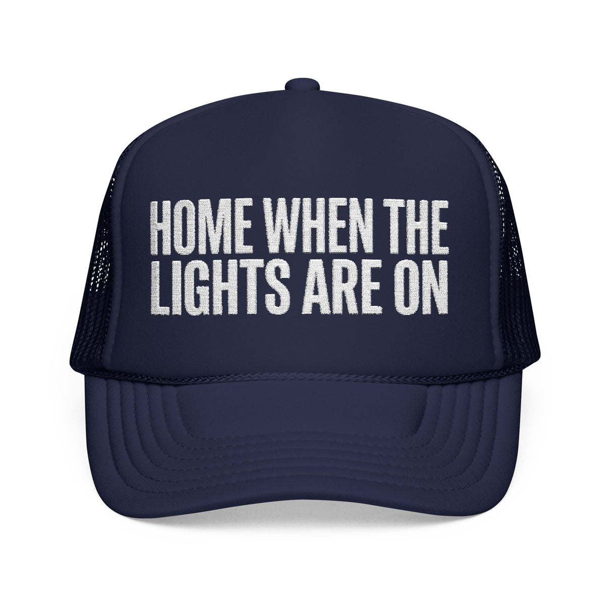 Dark navy Home When The Lights Are On trucker hat, front view, white block lettering on the foam front panel.