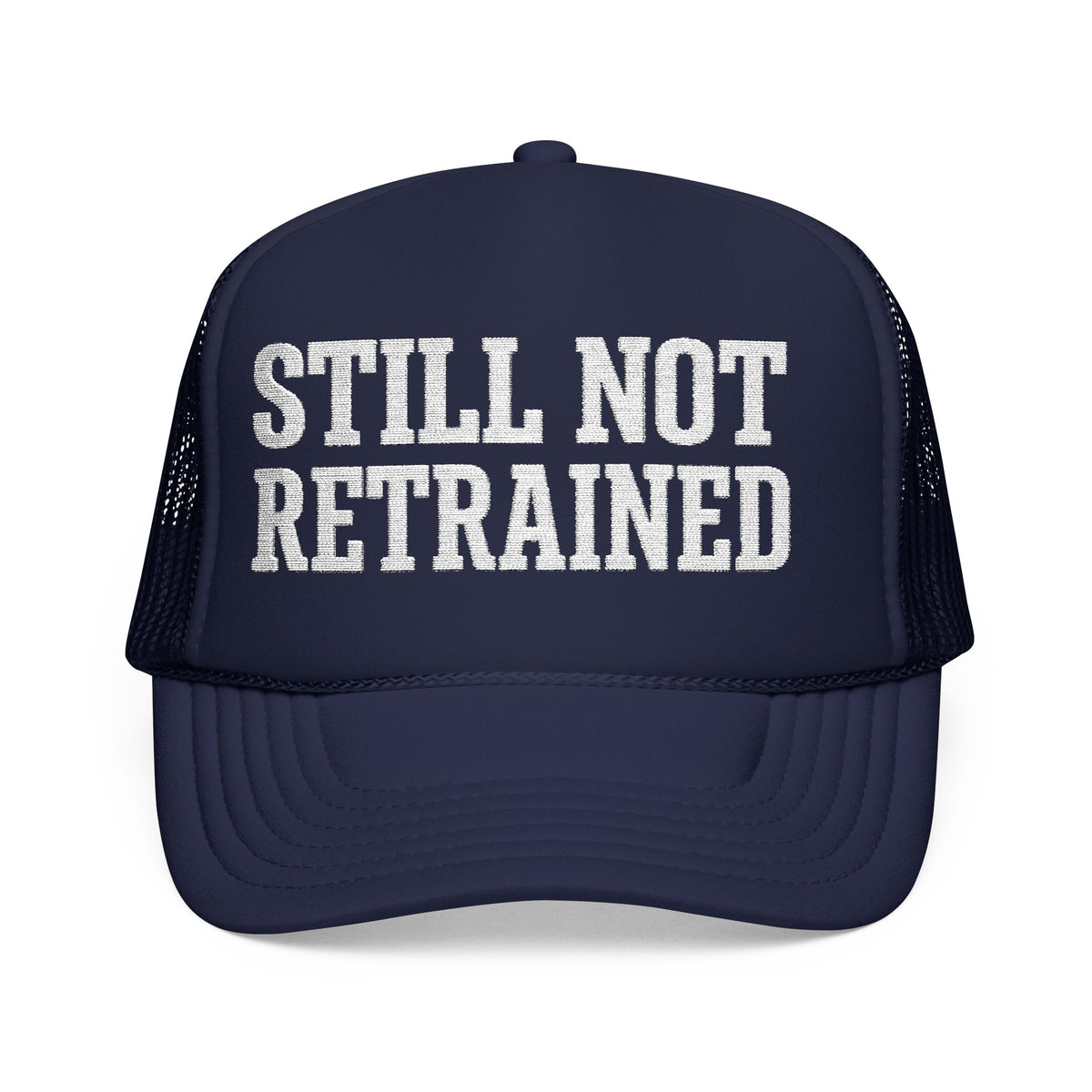 Dark navy Still Not Retrained foam trucker hat, front view, white block lettering on the foam front panel.