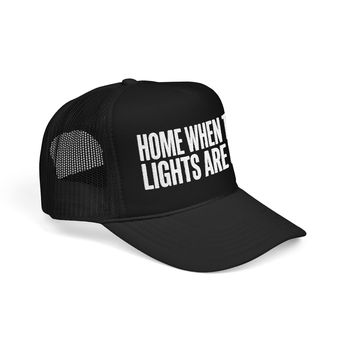 Black Home When The Lights Are On trucker hat at three-quarter angle, mesh back panel and pre-curved visor visible.