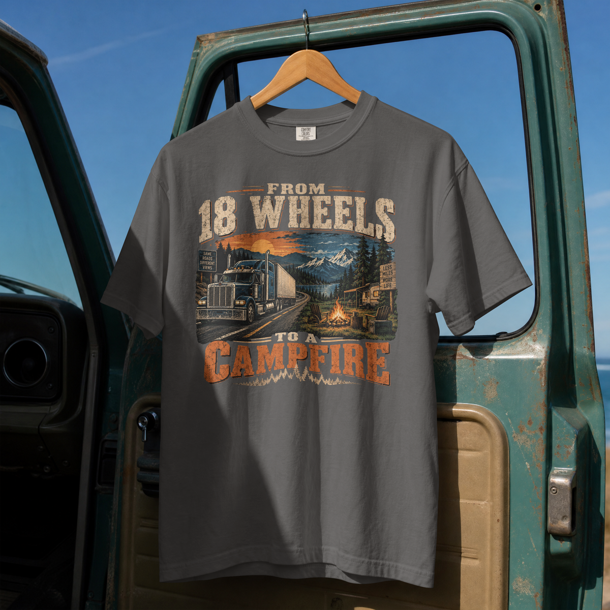 Pepper From 18 Wheels to a Campfire T-shirt, full front hanging view with semi-truck and campsite graphic.