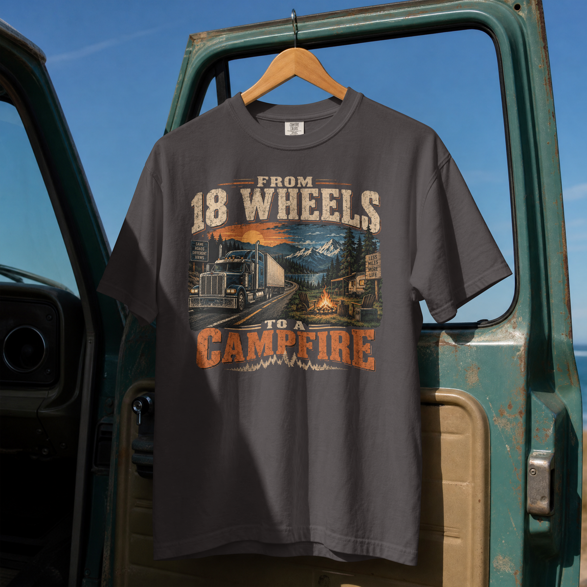 Graphite From 18 Wheels to a Campfire T-shirt, full front hanging view with semi-truck and campsite graphic.