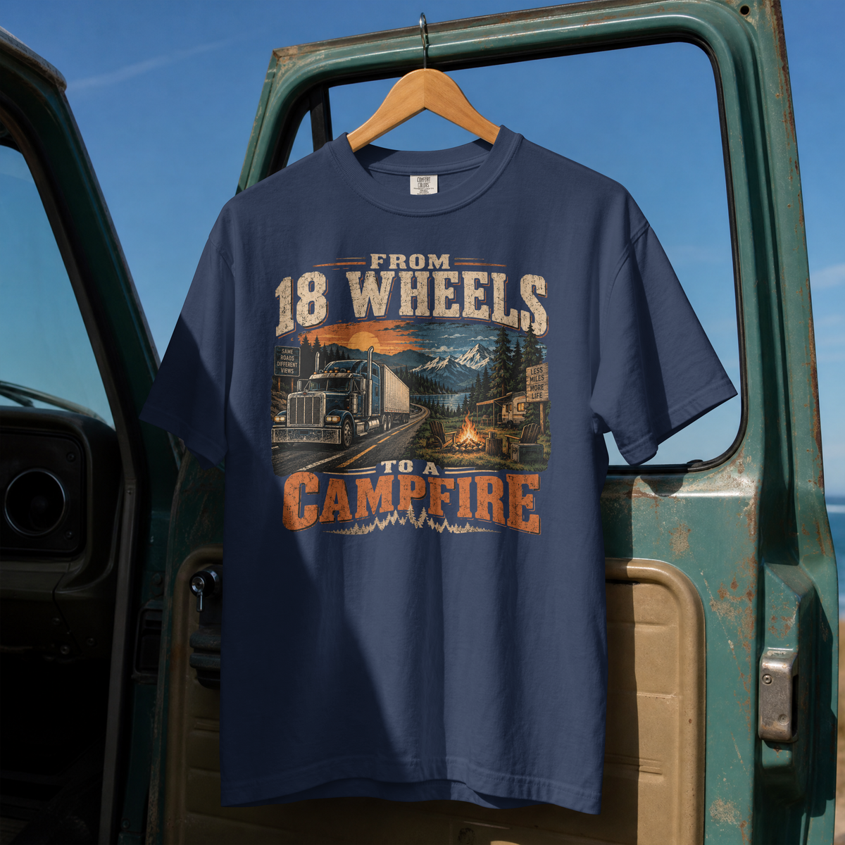 True Navy From 18 Wheels to a Campfire T-shirt, full front hanging view with semi-truck and campsite graphic.