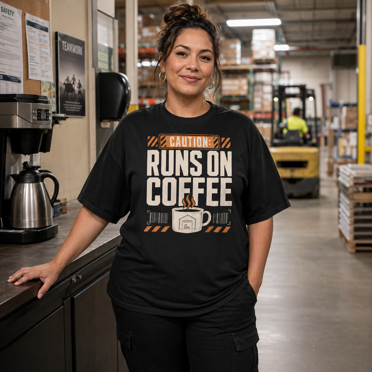 Woman warehouse worker wearing Caution Runs on Coffee heavyweight work T-shirt
