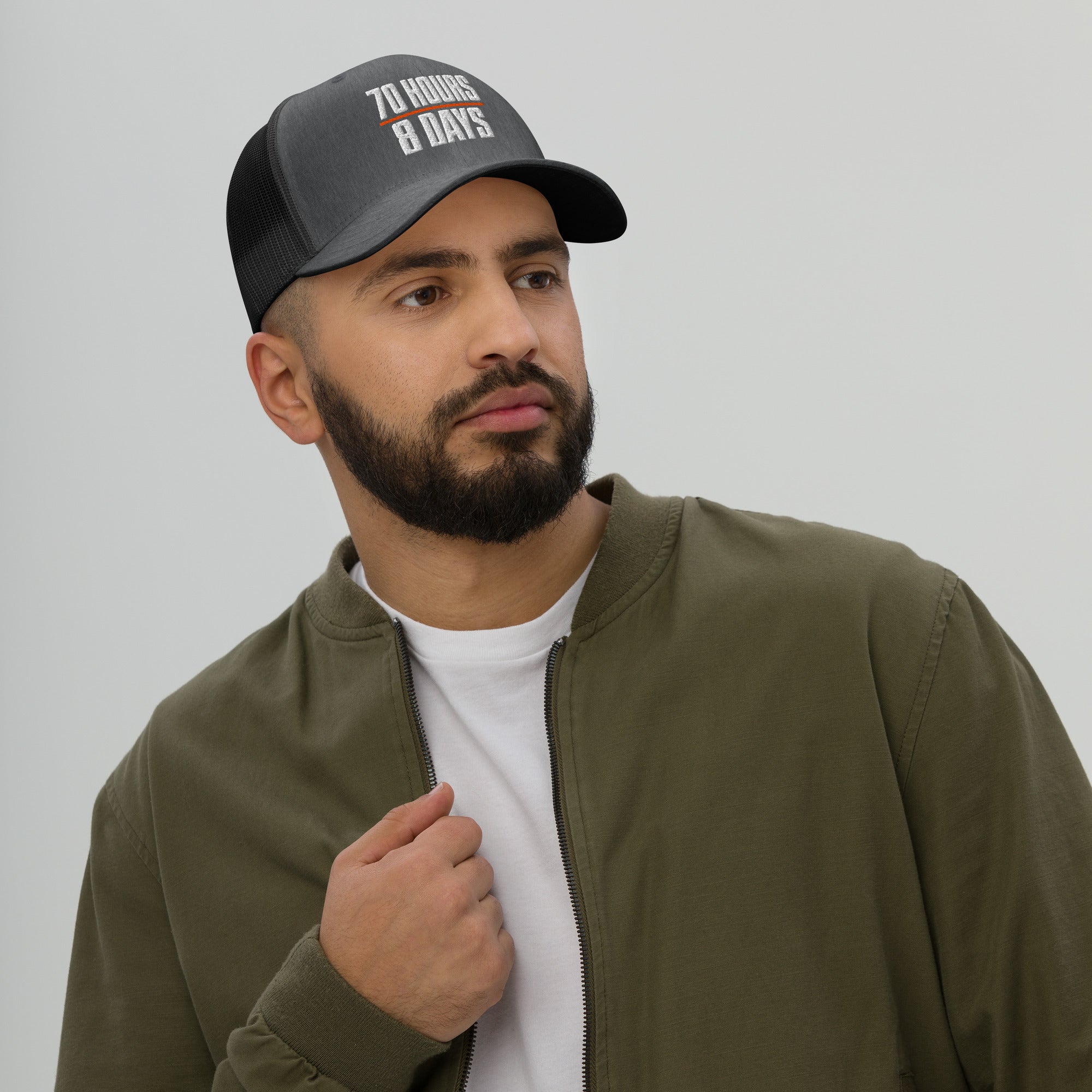 70 Hours in 8 Days embroidered trucker hat in dark heather gray, front view