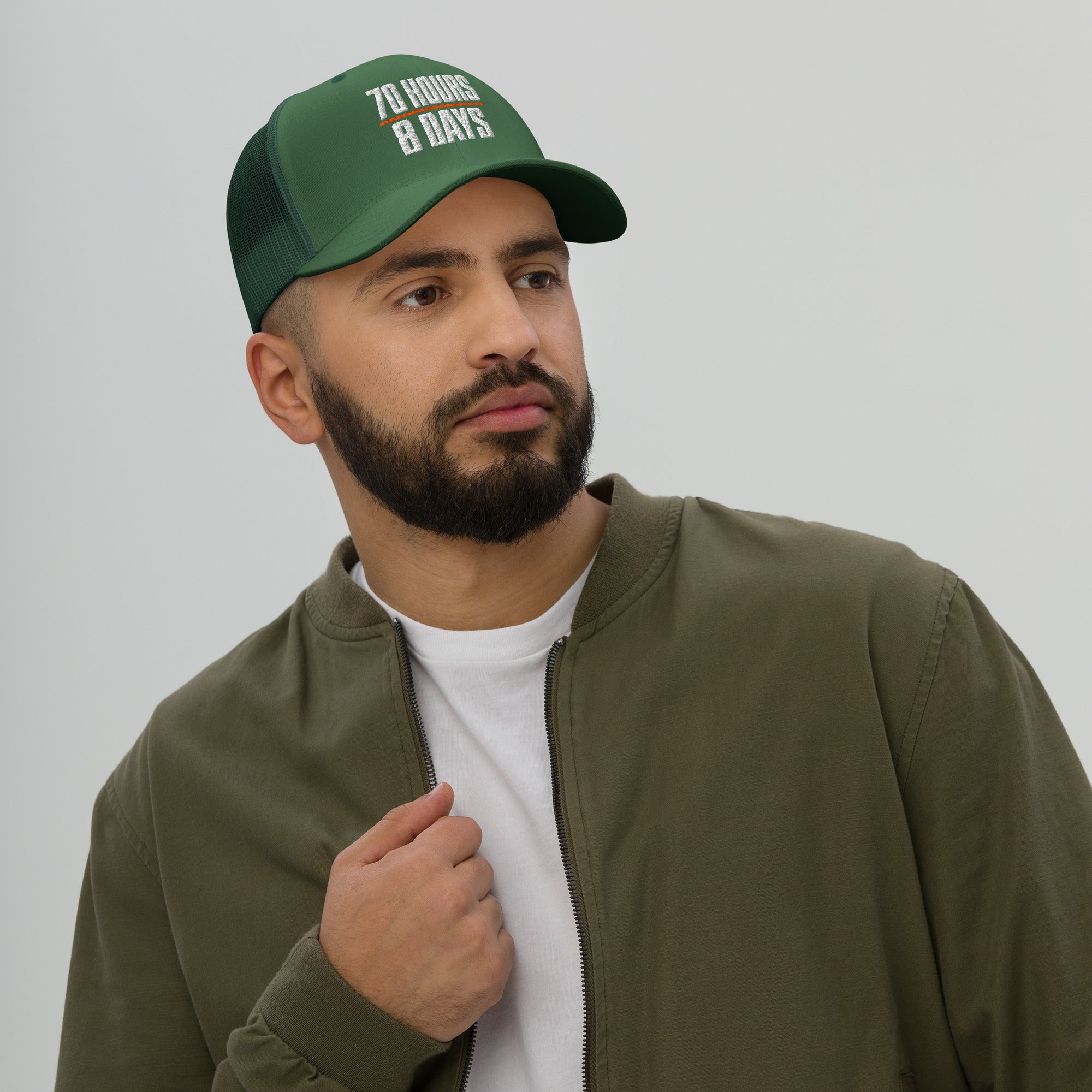 70 Hours in 8 Days embroidered trucker hat in evergreen for truck drivers, front view