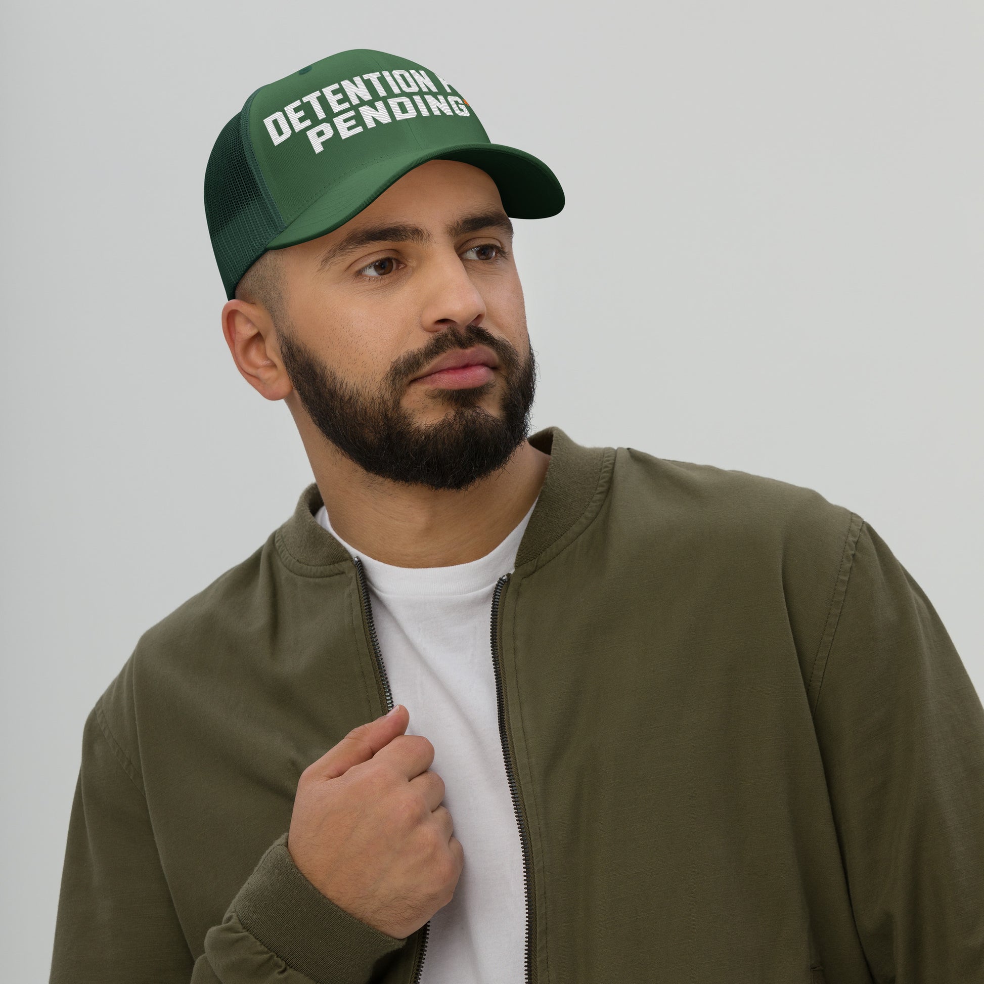 Detention Pay Pending embroidered trucker hat in evergreen, front view