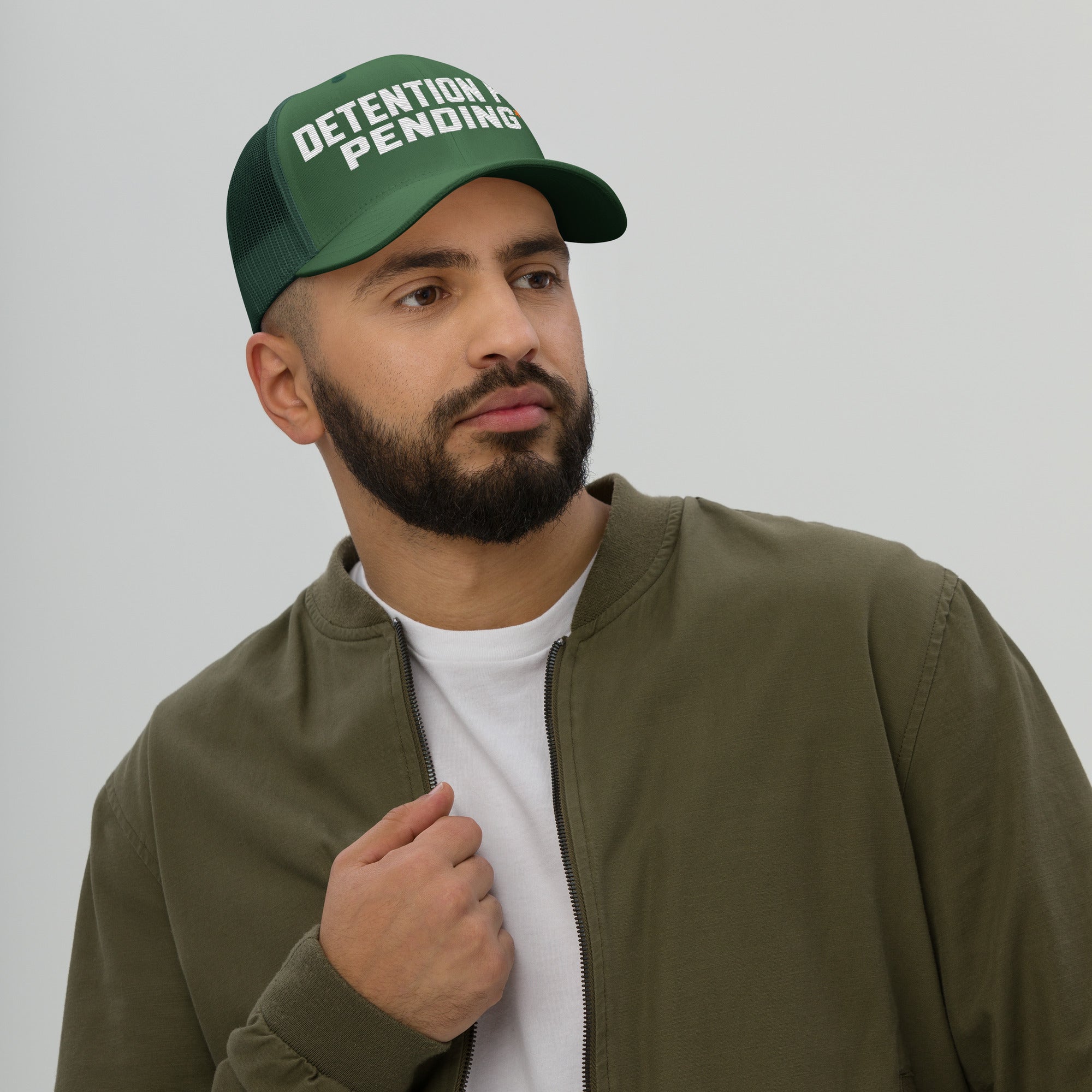 Detention Pay Pending embroidered trucker hat in evergreen, front view
