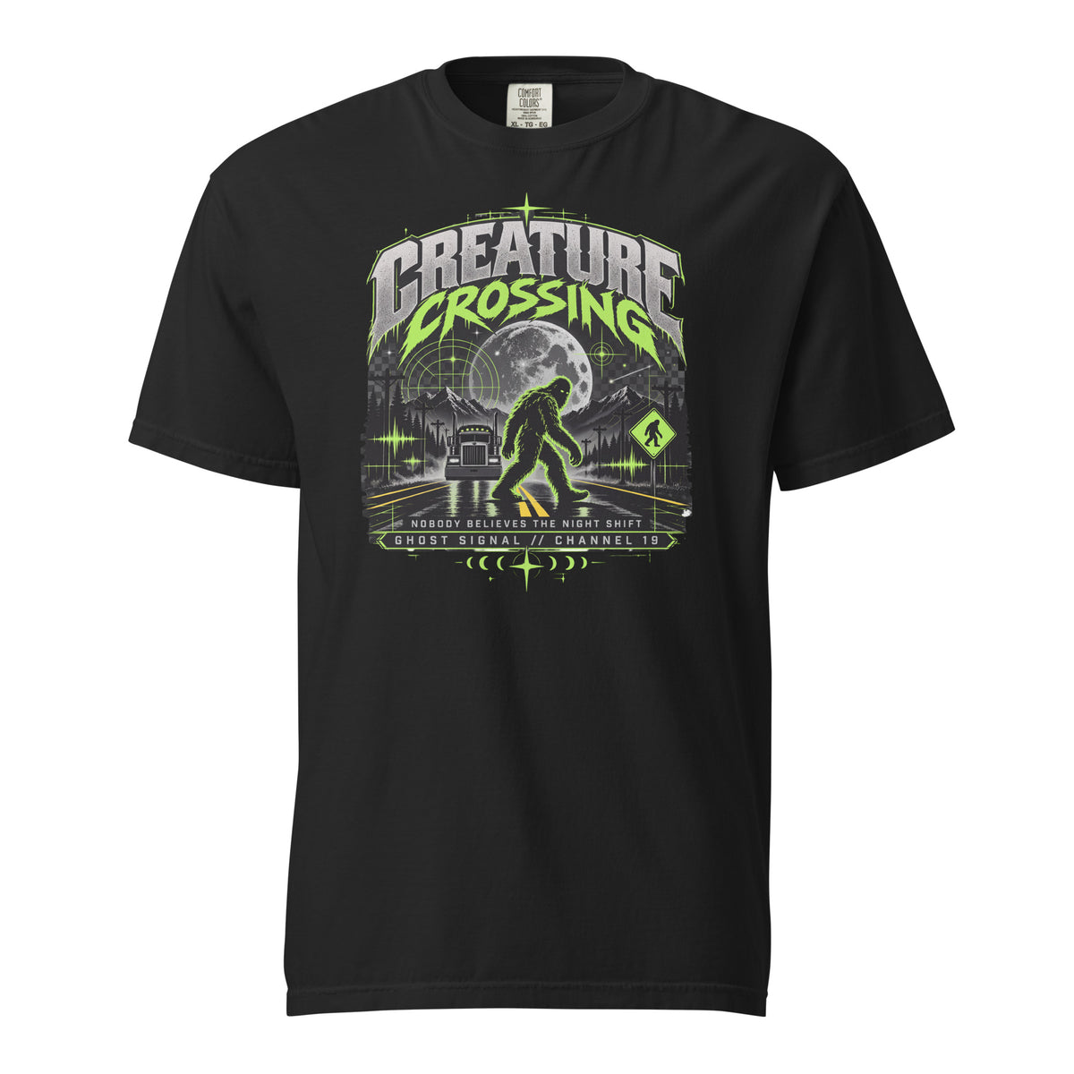 Black Creature Crossing graphic tee with green Sasquatch highway artwork and night-shift slogan
