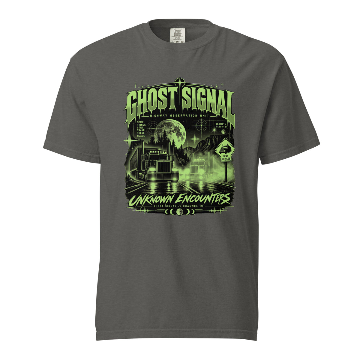 Pepper gray Ghost Signal paranormal trucker graphic T-shirt showing two semi-trucks, a green moon, mountains and mysterious highway scenery.