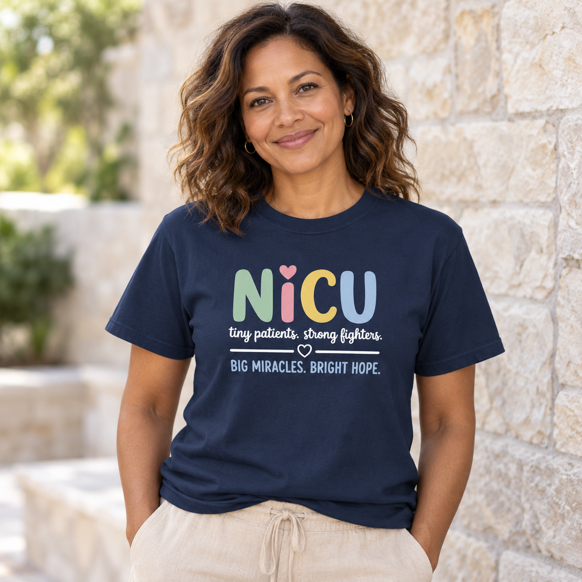 Woman wearing the True Navy XGRITX NICU nurse T-shirt showing its front design