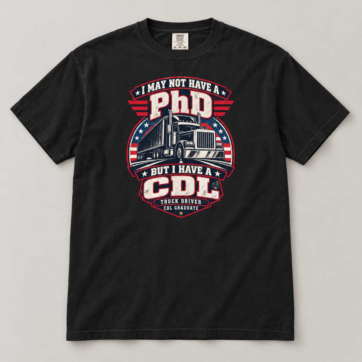 AI flat-lay mockup of a Black patriotic PhD versus CDL trucker graduation T-shirt, showing the semi-truck badge, stars and stripes on the front.
